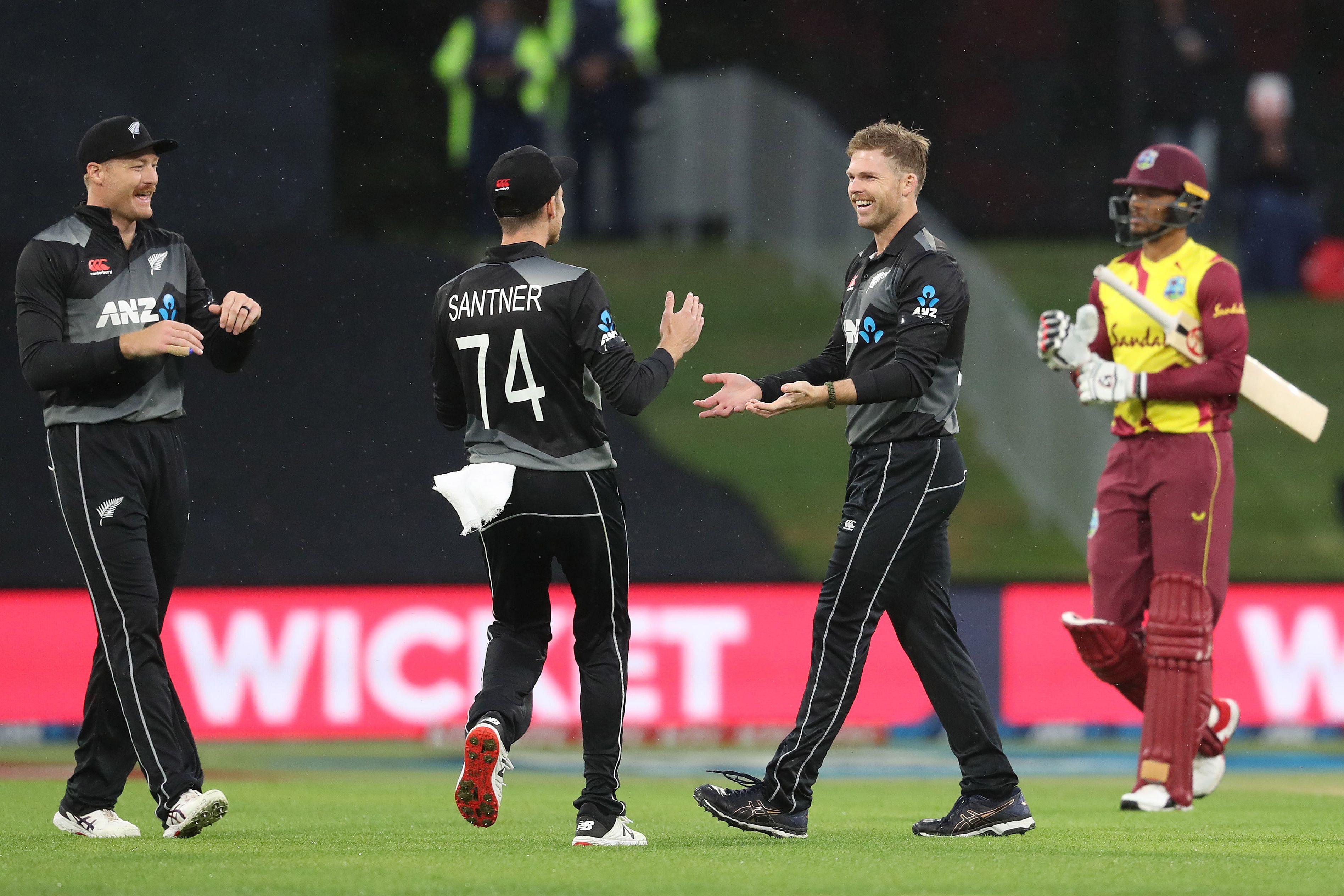 New Zealand’s Lockie Ferguson (2nd R) celebrates with Mitchell Santner (C) and Martin Guptill (L) for the wicket of West Indies' Brandon King (R) during the third Twenty20 International cricket. Credit: AFP Photo