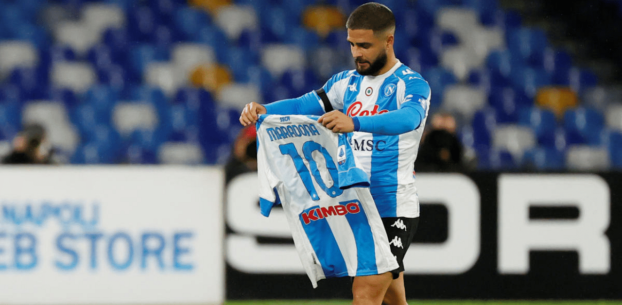 Napoli's Lorenzo Insigne celebrates scoring their first goal while paying tribute to Diego Maradona. Credit: Reuters Photo