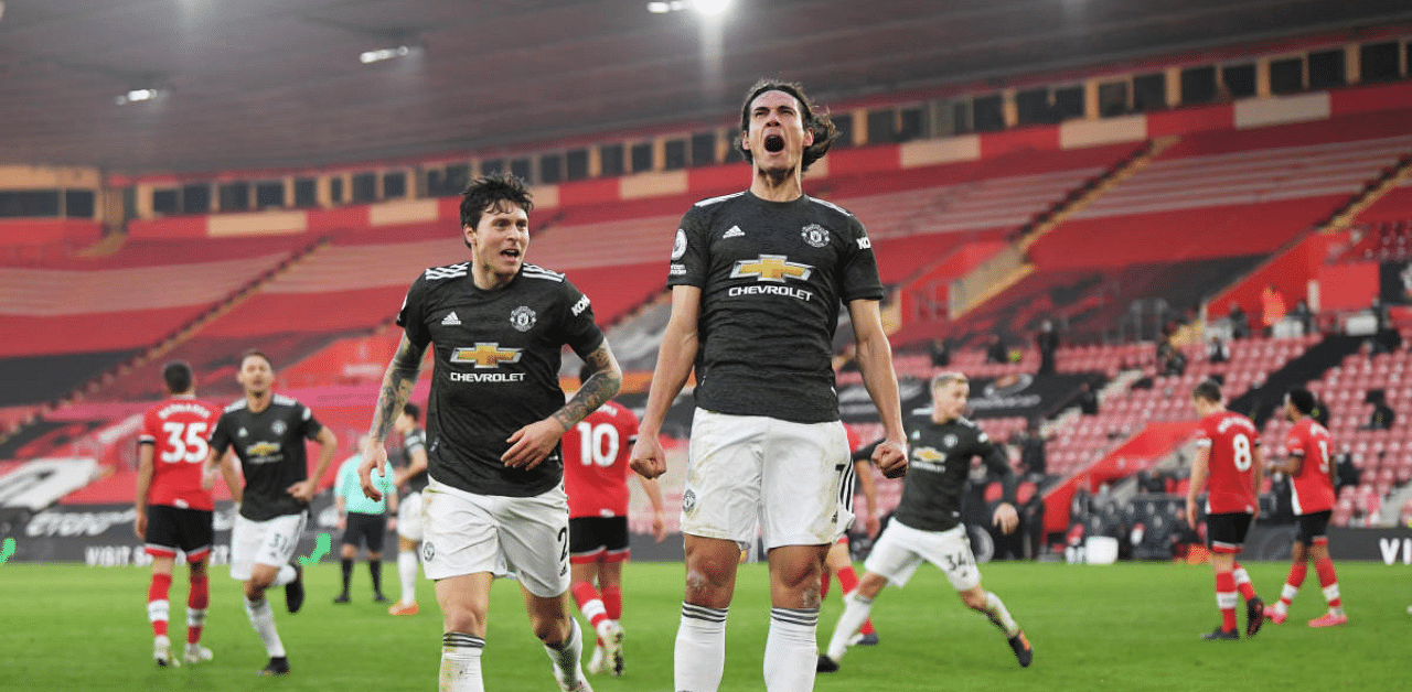  Manchester United's Edinson Cavani celebrates scoring their second goal. Credit: Reuters Photo