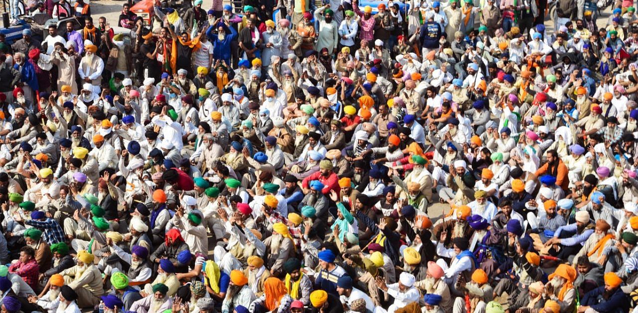 Farmers gathered at the Singhu border during their ongoing 'Delhi Chalo' protest against Centre's new farm laws, in New Delhi. Credit: PTI