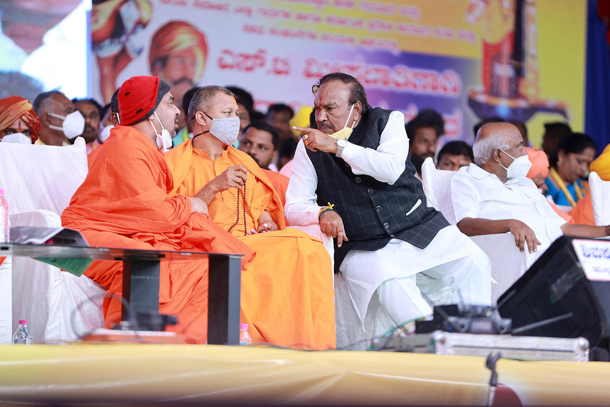 RDPR Minister K S Eshwarappa makes his displeasure known to Siddaramapuri Swami of Kanaka Gurupeeth (Tinthini) after the seer attacked the Yediyurappa-led government saying it is restricted to a particular community, during Kuruba convention in Bagalkot o