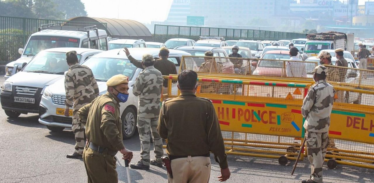 Heavy traffic jam at Gurugram- Delhi border as police stop vehicles for checking in view of the farmers' agitation over new farm laws, near Sirhaul toll plaza in Gurugram. Credit: PTI Photo