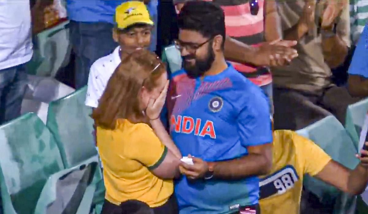 An Indian fan proposes to his Australian girlfriend during the India versus Australia ODI match at the Sydney Cricket Ground (SCG), in Sydney. Credit: PTI
