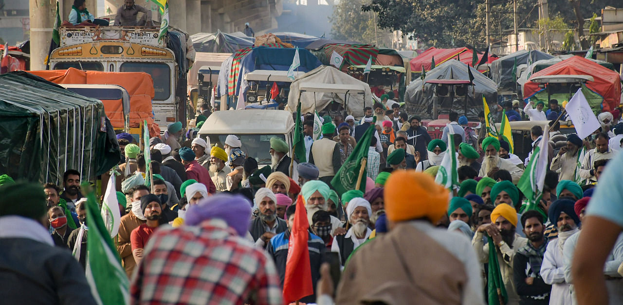 Farmers stage a protest at Tikri border over farm reform laws, in New Delhi. Credit: PTI Photo