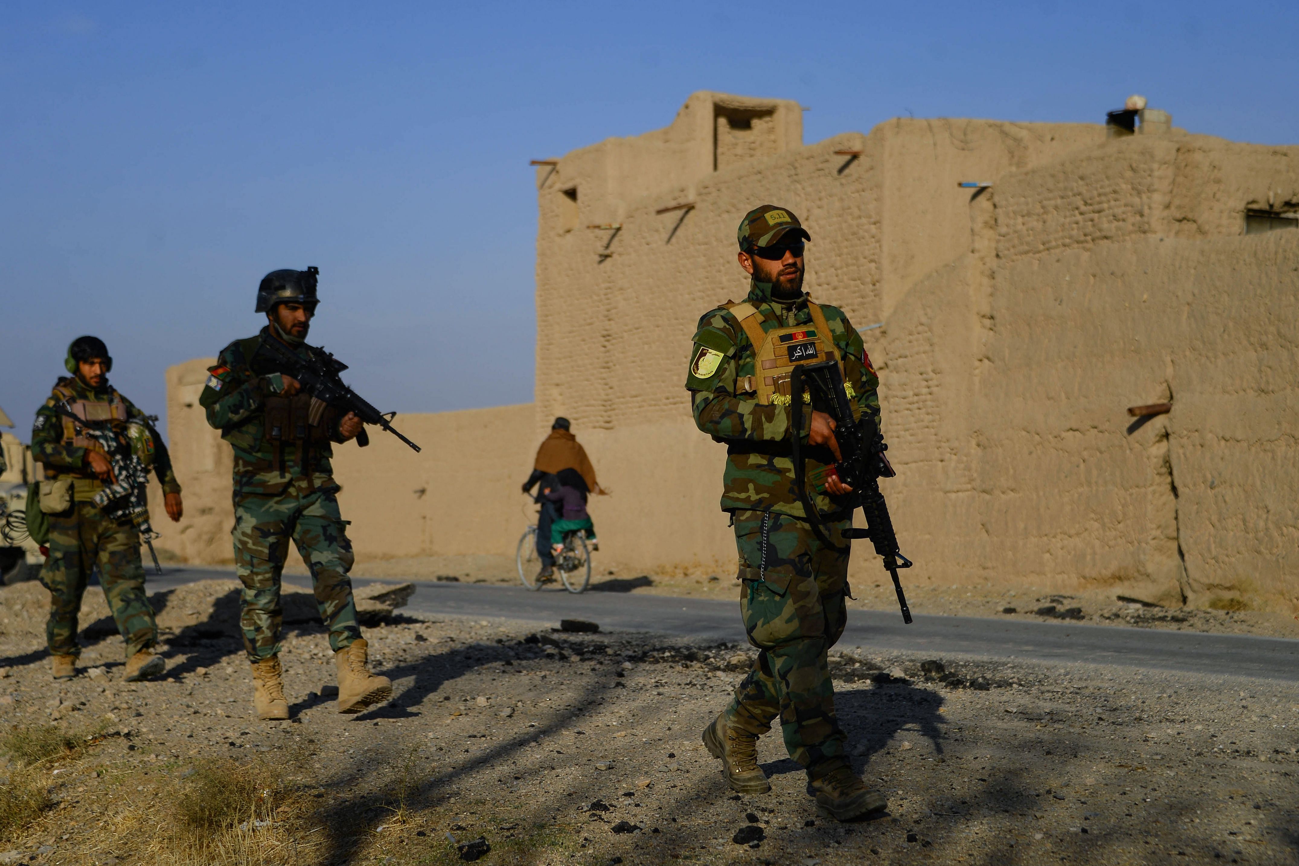 Afghan National Army (ANA) and Afghan Local Police (ALP) forces patrol during a cleaning operation in Pashtun Zarghun district. Credit: AFP Photo