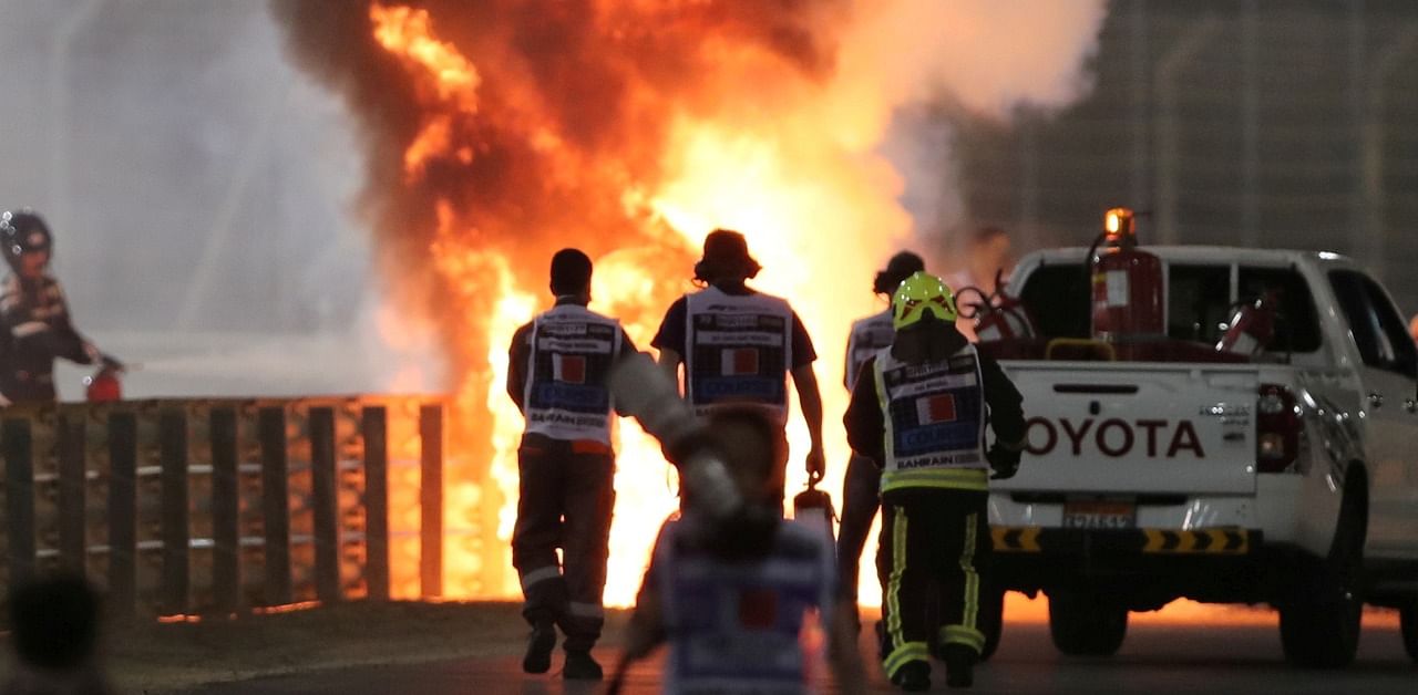 Flames seen from the crash scene after Haas' Romain Grosjean crashed out at the start of the race. Credit: AFP Photo
