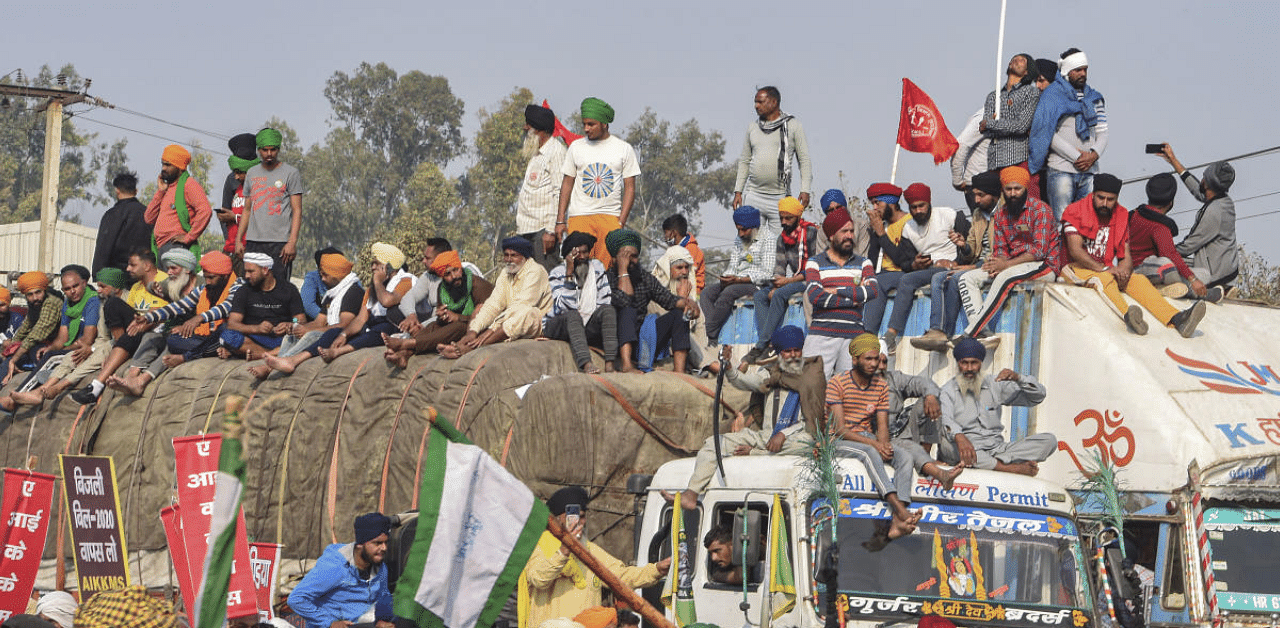 Farmers gather at the Singhu border during their ongoing 'Delhi Chalo' protest against Centre's new farm laws, in New Delhi. Credit: PTI Photo