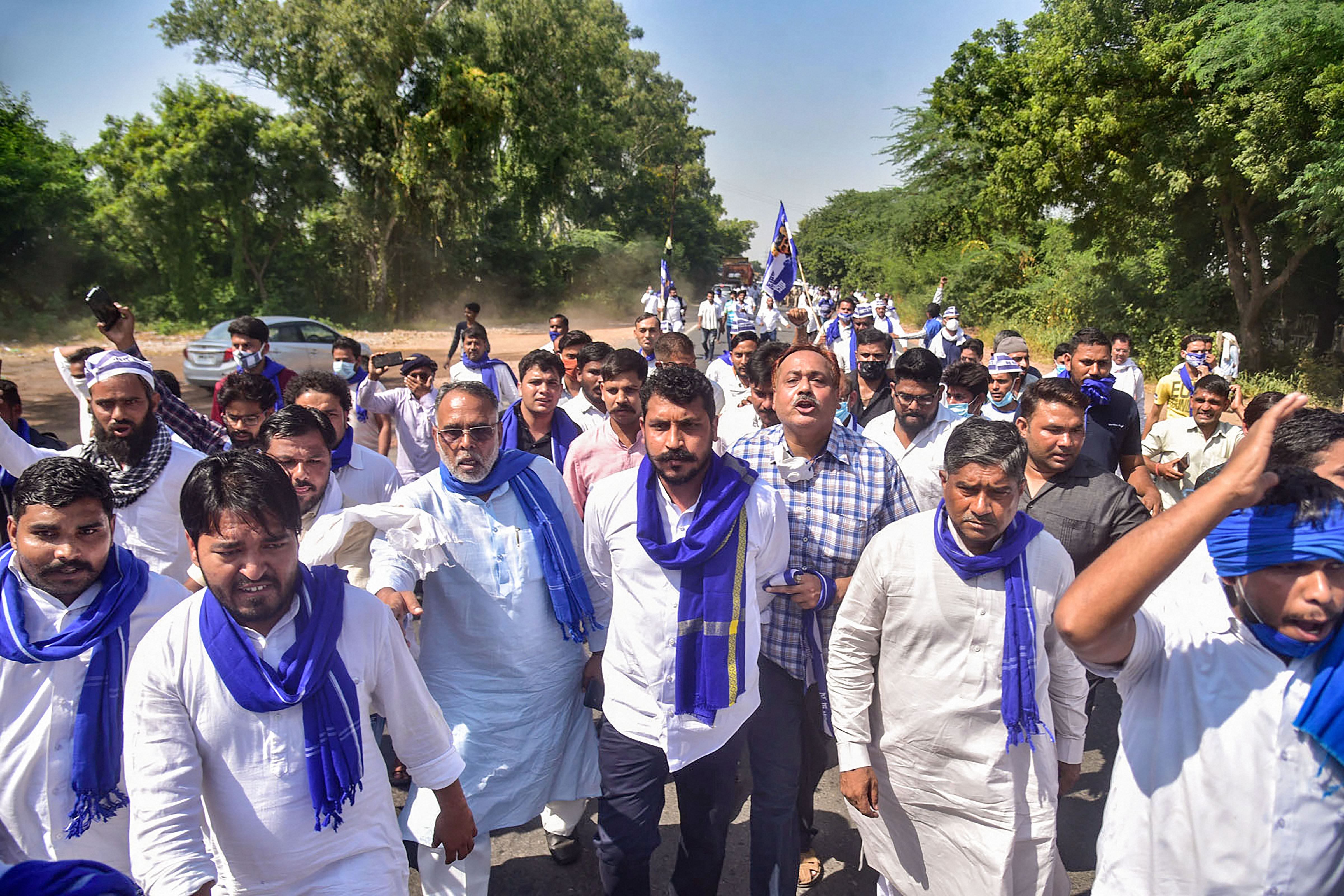 Bhim Army President Chandrashekhar Azad along with party workers on his way to meet the family members of a 19-year-old Dalit woman who died after being allegedly gang-raped two weeks ago, at Sasni road in Hathras, Sunday, Oct. 4, 2020. Credit: PTI Photo