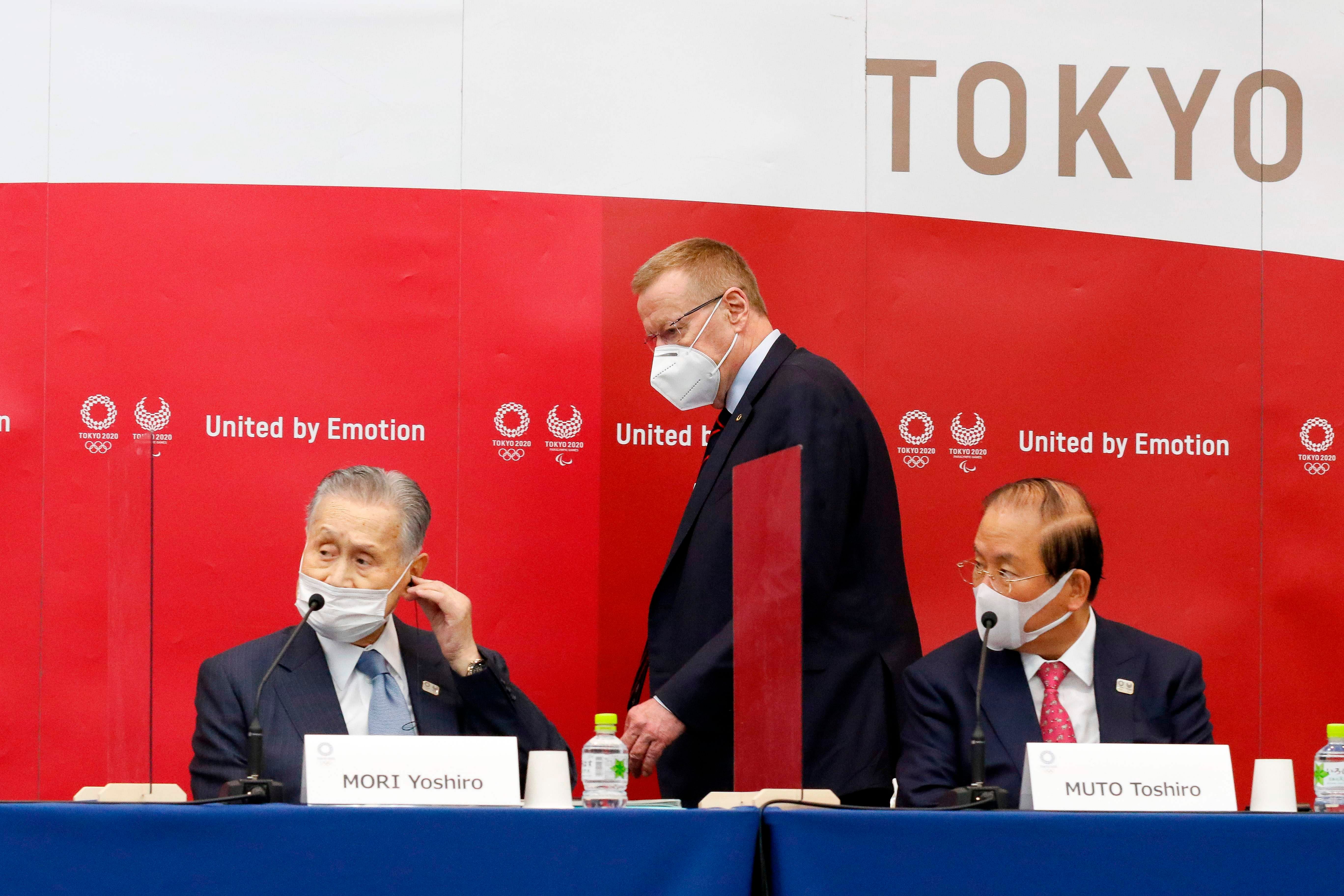 Olympic Committee vice president John Coates (C), Yoshiro Mori (L), president of Tokyo 2020, and Toshiro Muto (R) CEO of Tokyo 2020. Credit: AFP Photo