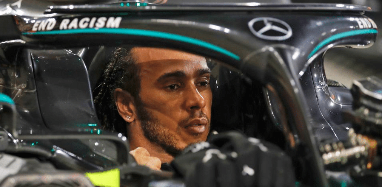 In this file photo taken on November 29, 2020 Mercedes' British driver Lewis Hamilton is pictured in his car after winning the Bahrain Formula One Grand Prix at the Bahrain International Circuit in the city of Sakhir on November 29, 2020. Credit: AFP