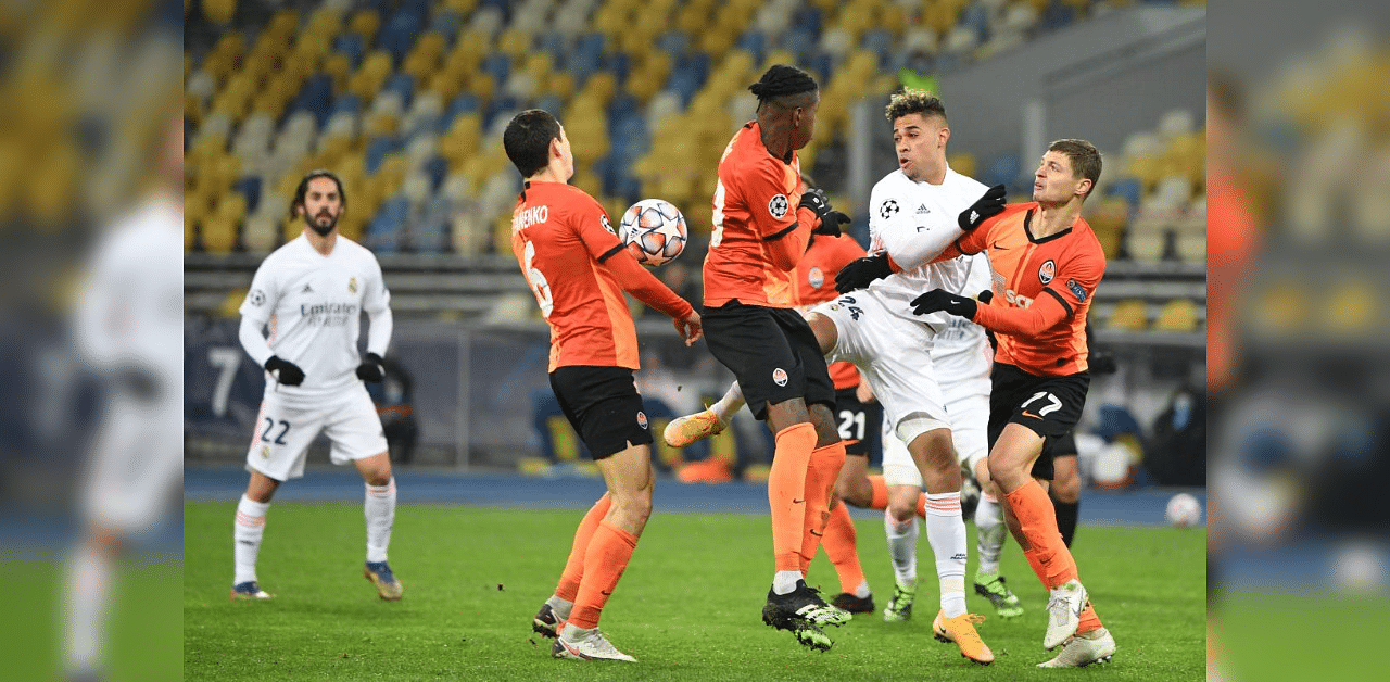 Real Madrid's Dominicans forward Mariano ( 2nd-R) fights for the ball with Shakhtar Donetsk's Brazilian defender Vitao ( 2nd-L), Shakhtar Donetsk's Ukrainian midfielder Taras Stepanenko (L) and Shakhtar Donetsk's Ukrainian defender Maksym Malyshev during the UEFA Champions League Group B football match between Shakhtar Donetsk and Real Madrid at the Olimpiyskiy stadium in Kiev on December 1, 2020. Credit: AFP 