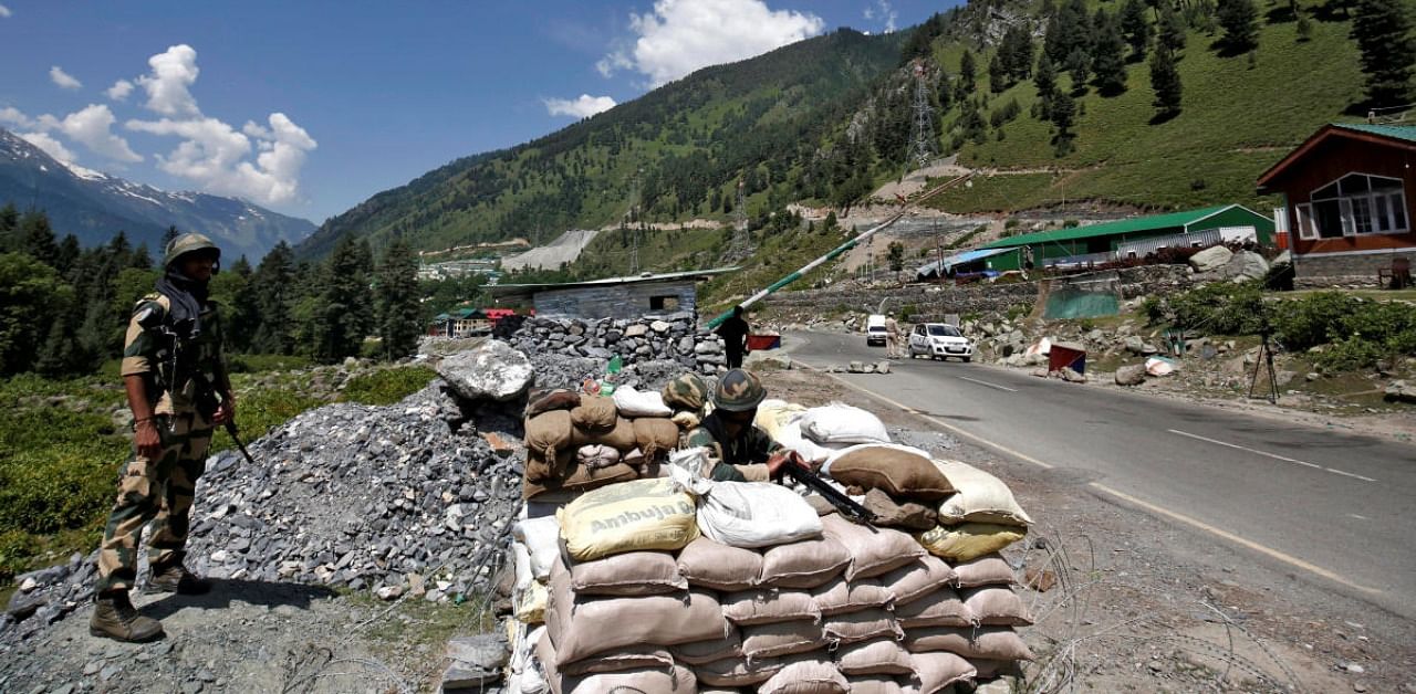 India's Border Security Force (BSF) soldiers stand guard at a checkpoint along a highway leading to Ladakh, at Gagangeer in Kashmir's Ganderbal district June 17, 2020. Credit: Reuters Photo