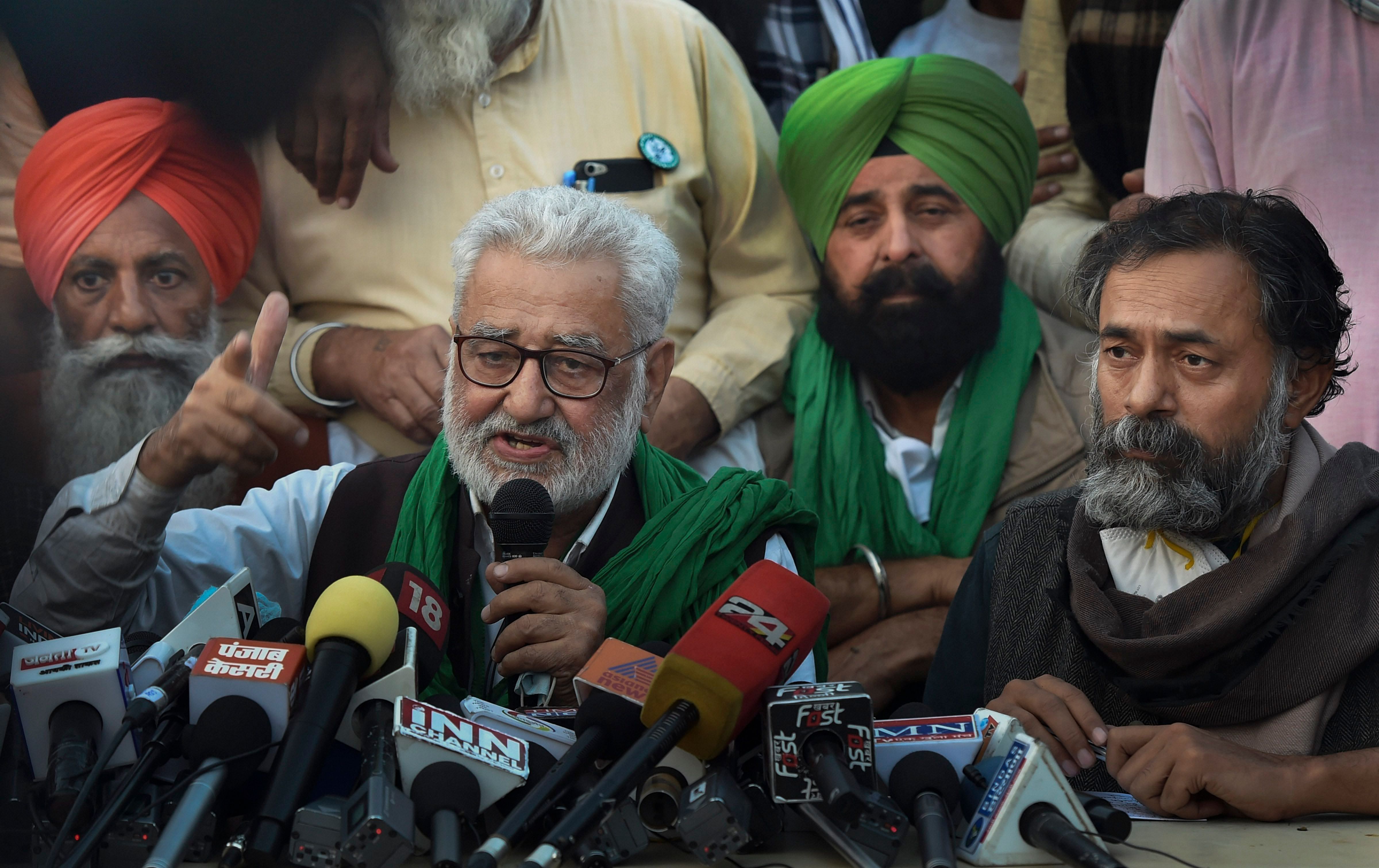 Darshan Pal, President of Krantikari Kisan Union addresses a press conference as Swaraj India President Yogendra Yadav (R) looks on during their 'Delhi Chalo' protest march against the Centre's new farm laws, at Singhu border in New Delhi, Wednesday, Dec. 2, 2020. Credit: PTI Photo