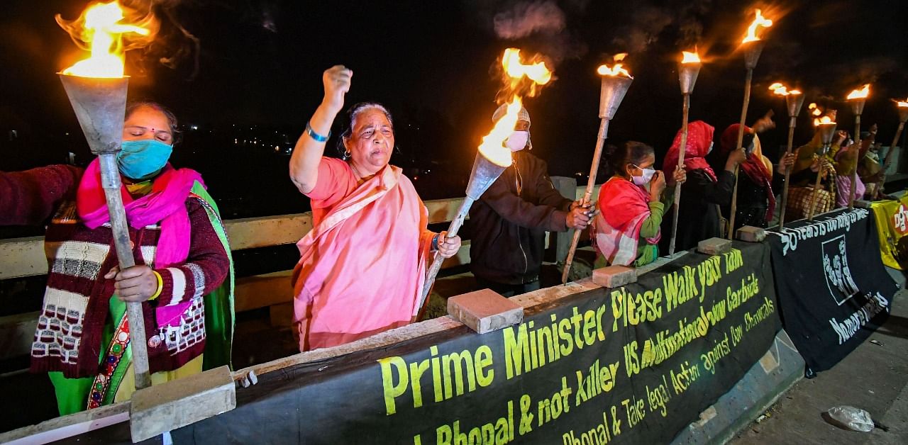 Survivors of the '1984 Bhopal Gas Disaster' take part in torch rally on 36th anniversary of the tragedy, in Bhopal. Credit: PTI Photo