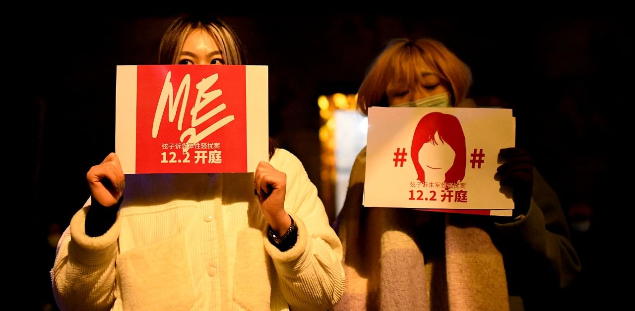 Supporters of Zhou Xiaoxuan, a feminist figure who rose to prominence during China’s #MeToo movement two years ago, display posters as they wait for Zhou outside of the Haidian District People’s Court. Credit: AFP Photo