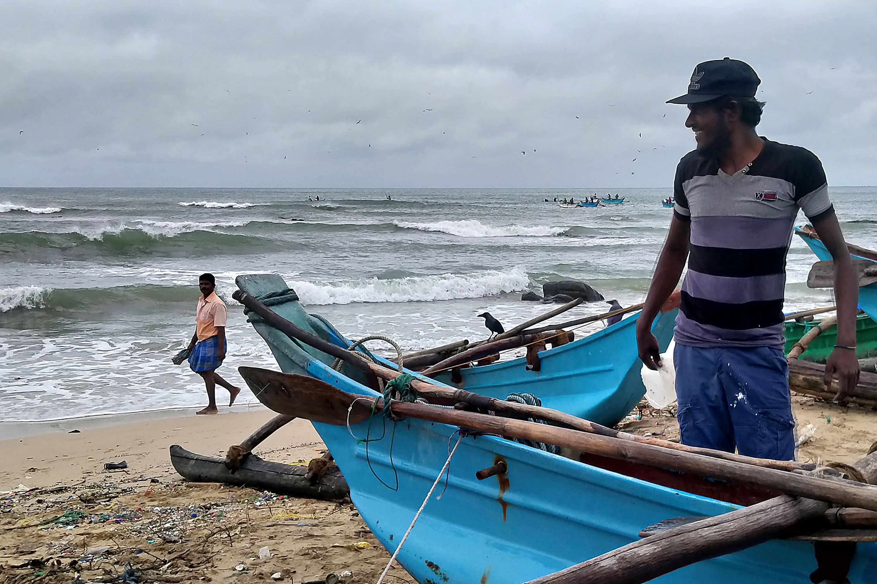 Fishermen prepare to go out in sea in Trincomalee on December 3, 2020. - Cyclone Burevi hit Sri Lanka overnight, rattling the island nation but leaving it relatively unscathed on its way to southern India, officials said on December 3. Credit: AFP Photo