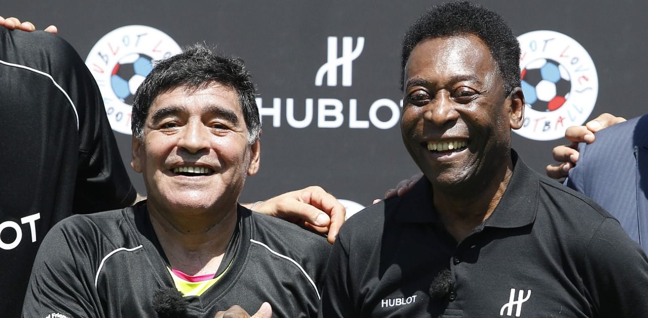 In this file photo taken on June 09, 2016, former Argentinian football international Diego Maradona (L) and former Brazilian footballer Pele pose after a football match. Credit: AFP Photo