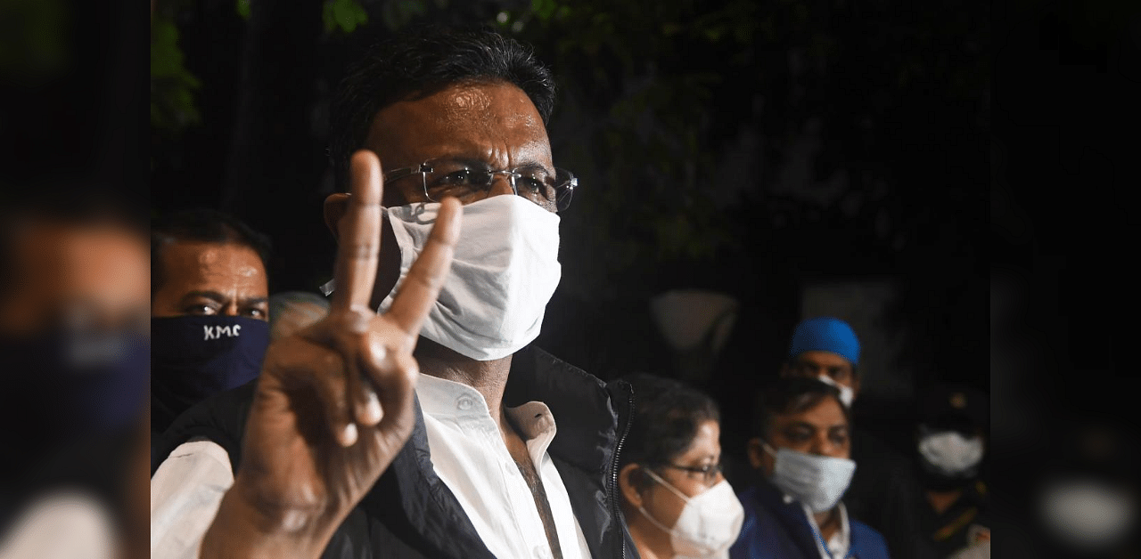 Chairman of the Board of Administrators of Kolkata Municipal Corporation (KMC) Firhad Hakim, gestures after taking the vaccine at the National Institute of Cholera and Enteric Diseases (NICED) as the institute launched the third phase of the regulatory trial of COVAXIN, in Kolkata on December 2, 2020. Credit: AFP Photo
