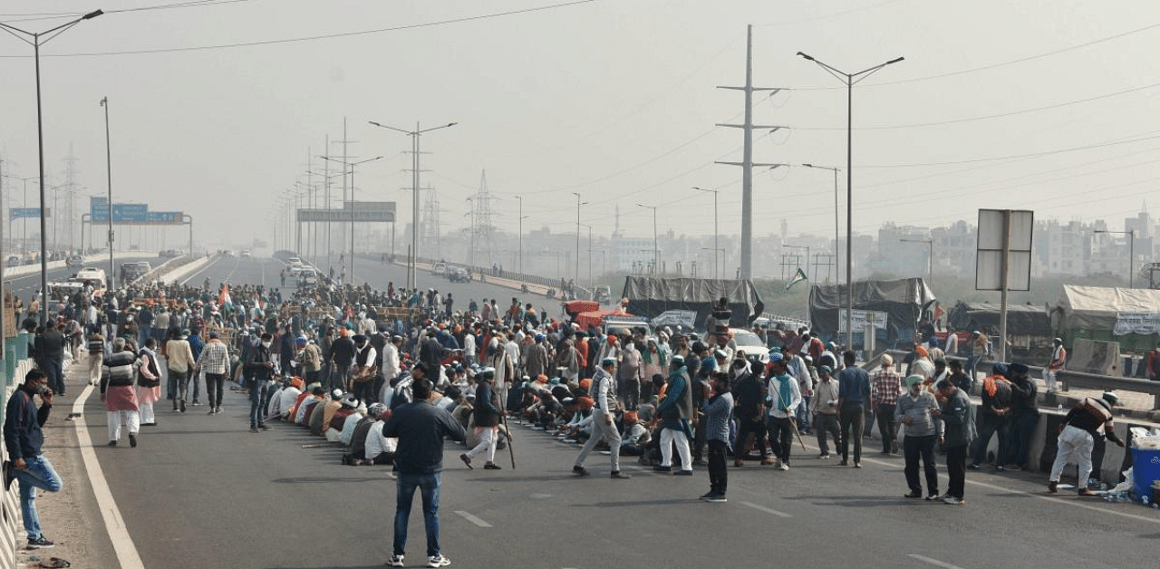 Farmers raise slogans during their 'Delhi Chalo' protest march against the new farm law, NH 24 at Ghazipur in New Delhi. Credit: PTI Photo