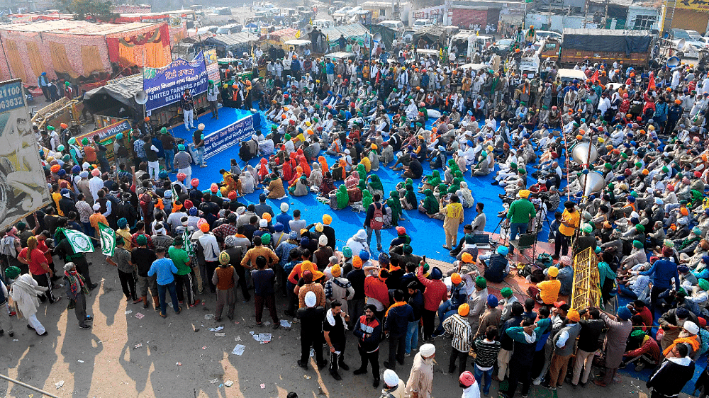 Farmers protest against the central government's recent agricultural reforms at the Delhi-Haryana state border in Singhu. Credit: AFP Photo