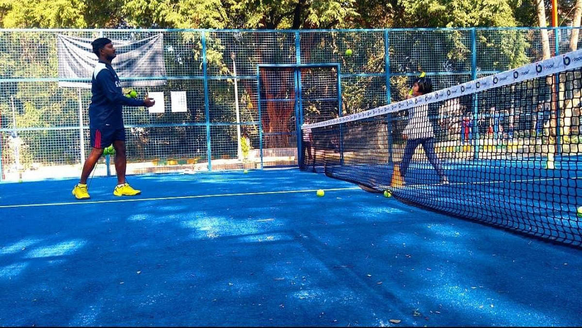 Padel coach DB Santosh (left) putting a young player through the paces.