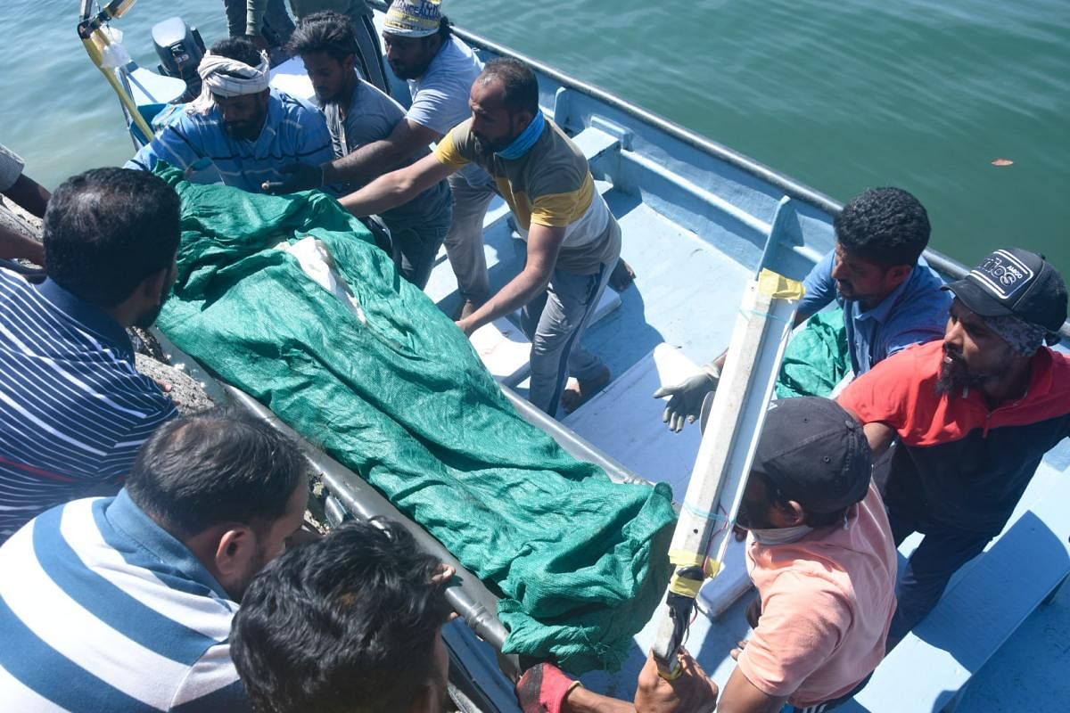 The body of a fisherman, recovered during the search operations in Arabian Sea, being shifted to the mortuary in district Wenlock hospital in Mangaluru on Wednesday. Credit: DH Photo