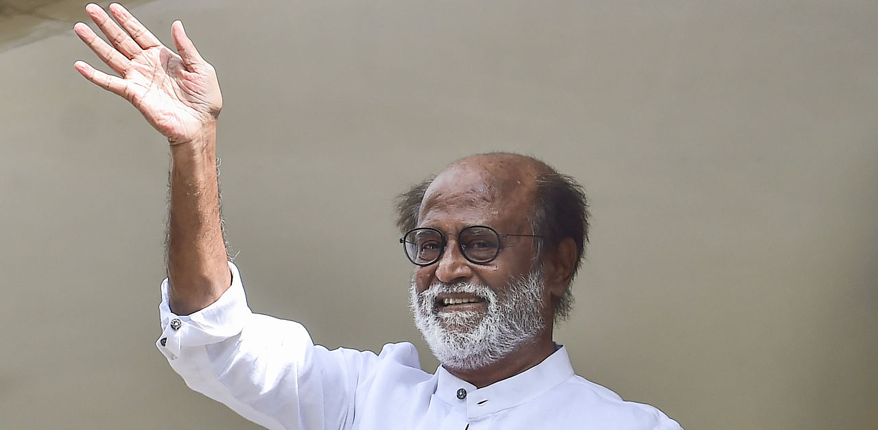 Actor-turned-politician Rajinikanth waves at his fans after meeting with the senior functionaries of Rajini Makkal Mandram (RMM) to decide on political plunge, in Chennai, Monday, Nov. 30, 2020. Credit: PTI Photo