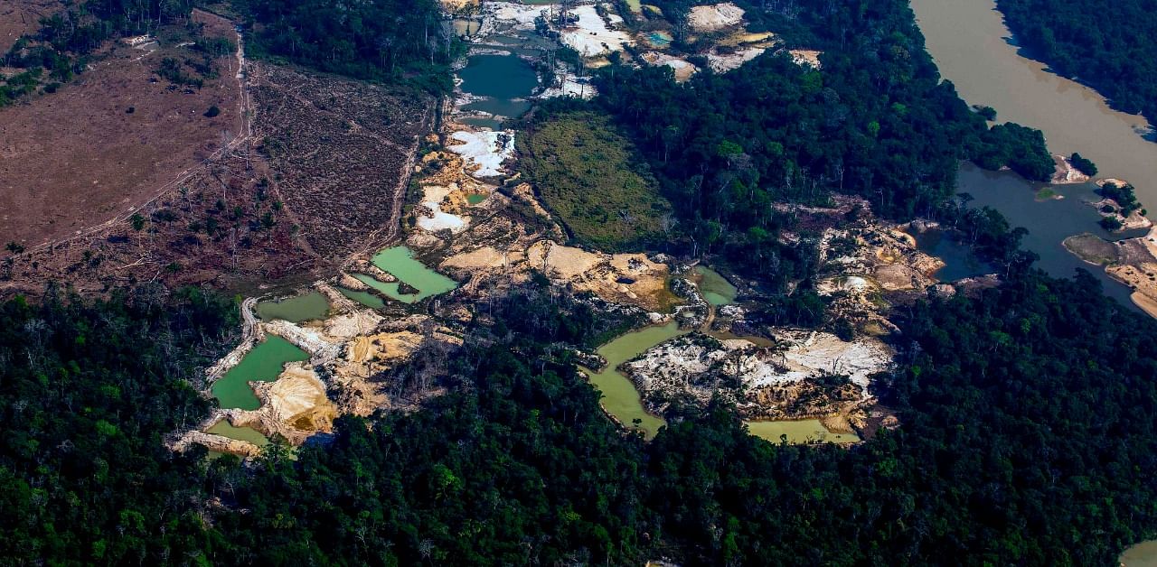 In this file photo taken on August 28, 2019, aerial view of the Esperanca IV informal gold mining camp, near the Menkragnoti indigenous territory, in Altamira, Para state, Brazil, in the Amazon basin. Credit: AFP Photo