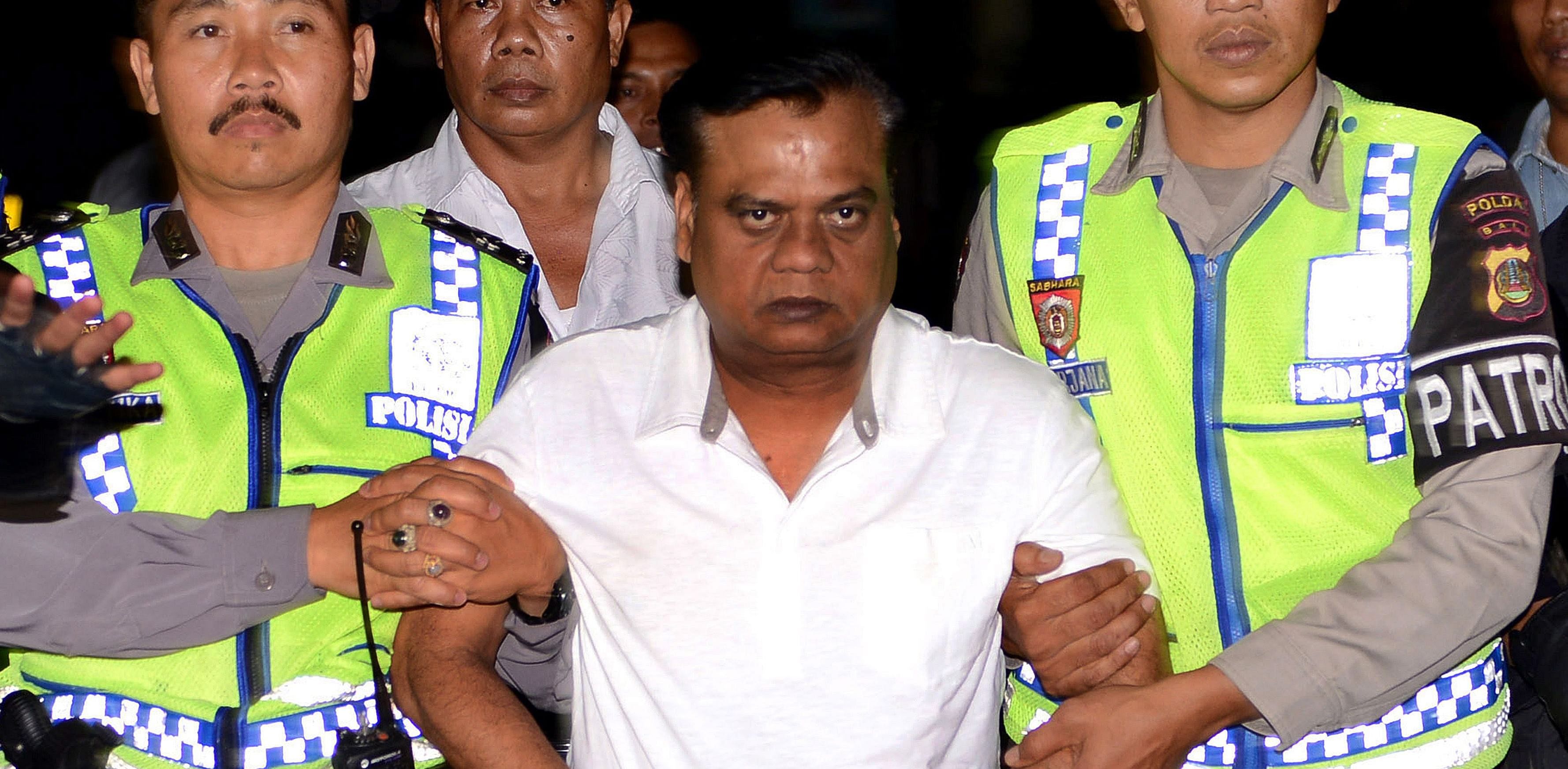  In this file photo taken on November 5, 2015 Indonesian police escort Indian national Chhota Rajan (C) from Bali police headquarters to Ngurah Rai Airport during his deportation from Denpasar on Bali island. Credit: AFP