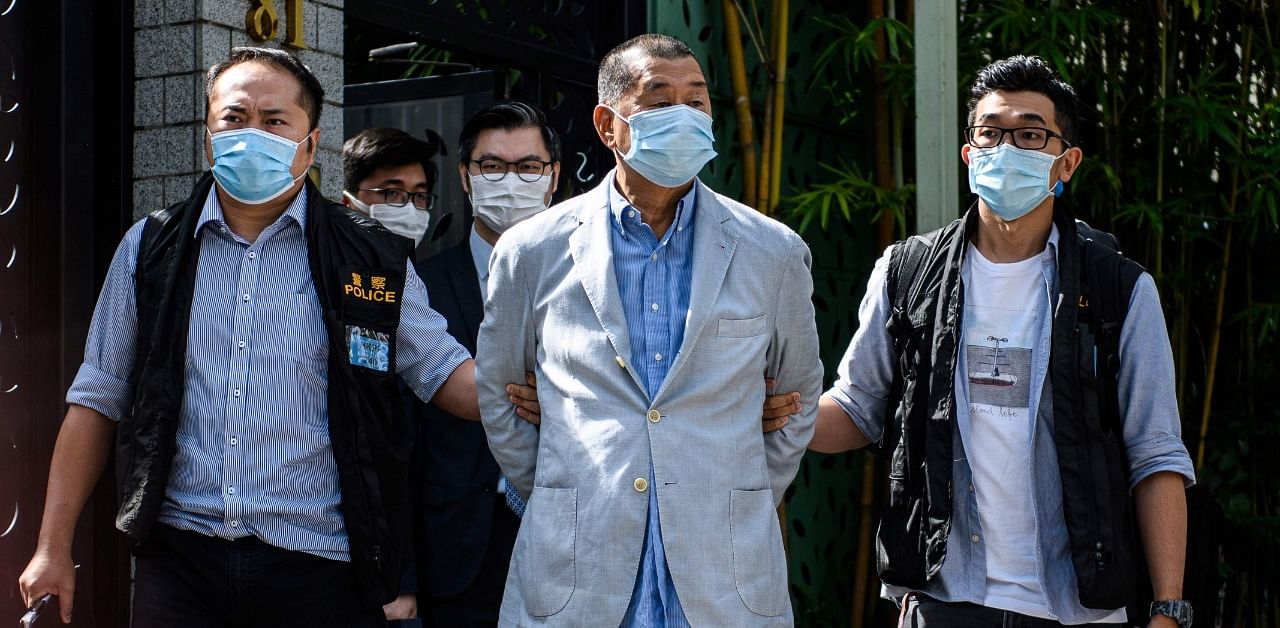 Police lead Hong kong pro-democracy media mogul Jimmy Lai (C), 72, away from his home after he was arrested under the new national security law in Hong kong on August 10, 2020. Credit: AFP Photo