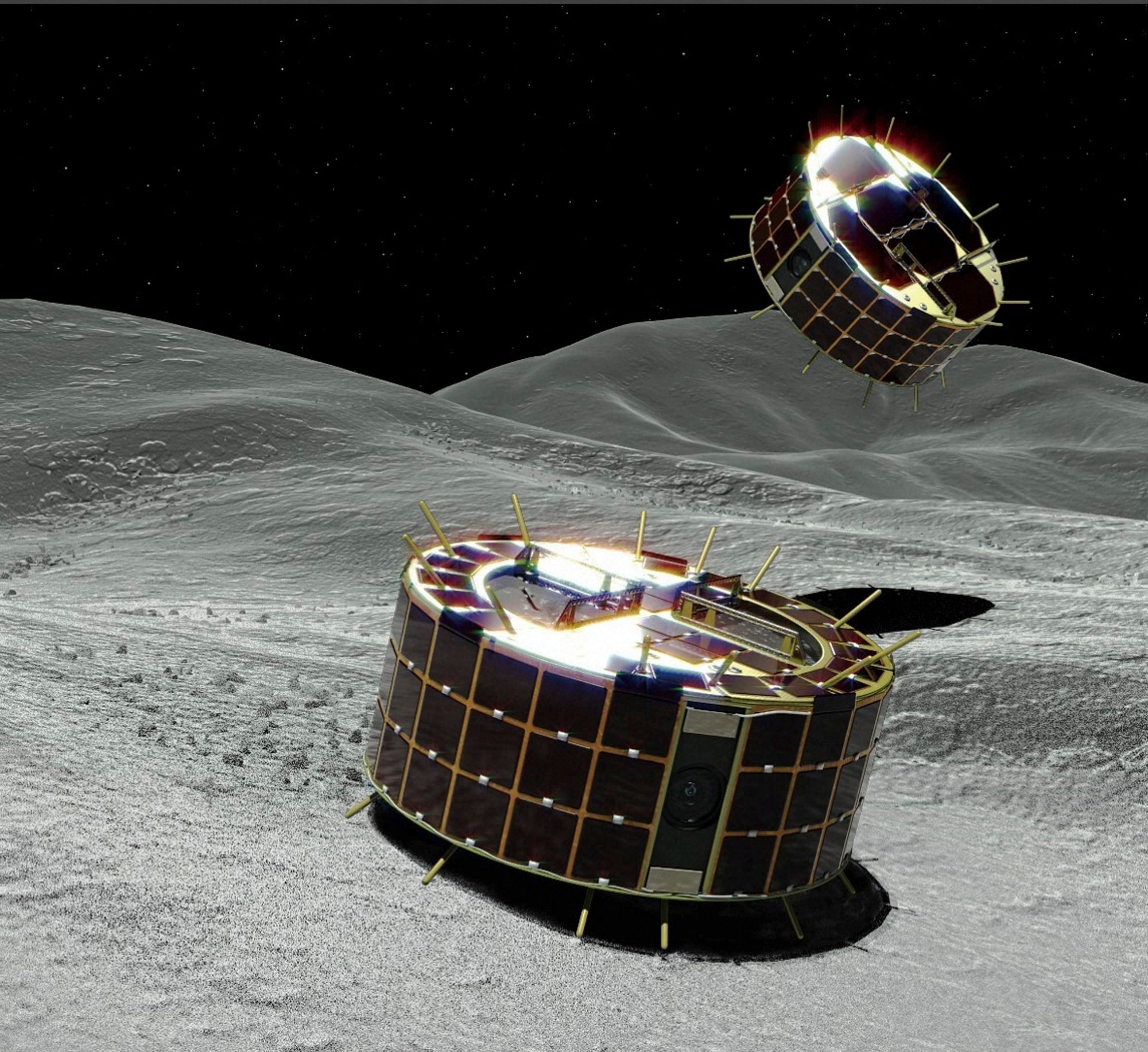 JAXA : This computer graphic image provided by the Japan Aerospace Exploration Agency (JAXA) shows two drum-shaped and solar-powered Minerva-II-1 rovers on an asteroid. Japanese unmanned spacecraft Hayabusa2 released two small Minerva-II-1 rovers on the asteroid Ryugu on Friday, Sept. 21, 2018, in a research effort that may provide clues to the origin of the solar system. JAXA said confirmation of the rovers' touchdown has to wait until it receives data from them on Saturday. Credit: AP/PTI