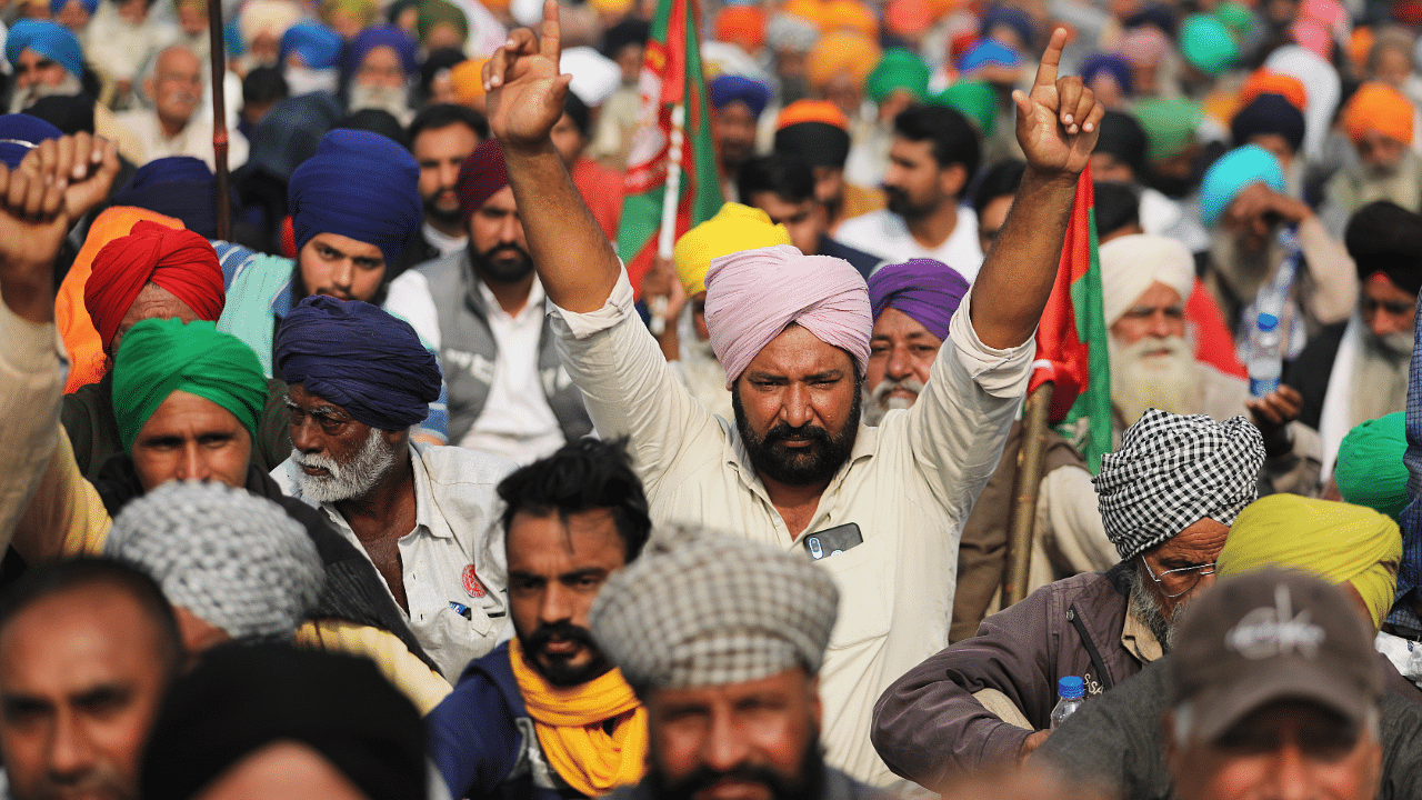 Farmers protest against the newly passed farm bills at Singhu border near Delhi. Credit: Reuters Photo