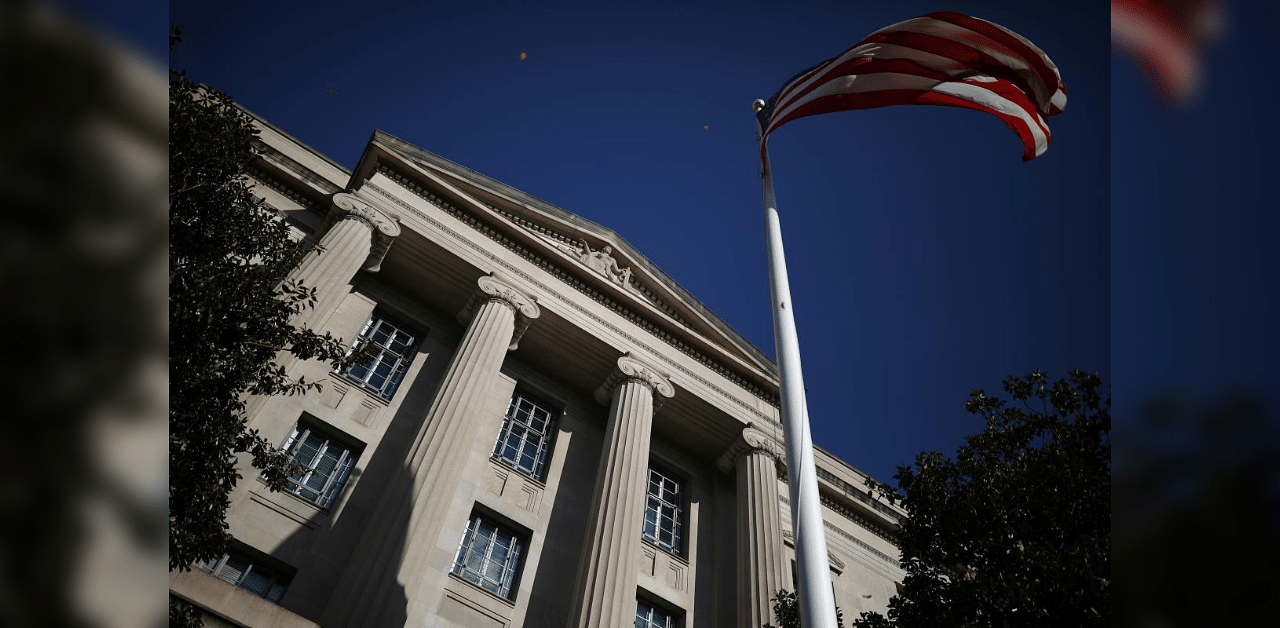 American flag waves outside the US Department of Justice Building in Washington. Credit: Reuters Photo