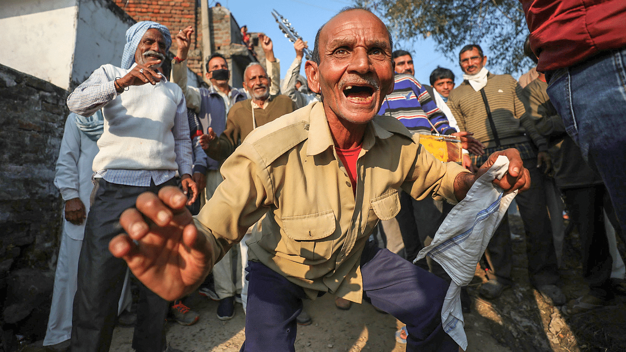 West Pakistani refugees celebrate after casting their votes during the third phase of District Development Council (DDC) election, at Chak Jafar village in Jammu. Credit: PTI Photo