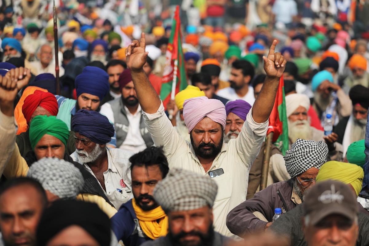 Farmers protest against the newly passed farm bills at Singhu border near Delhi. Credit: Reuters photo. 