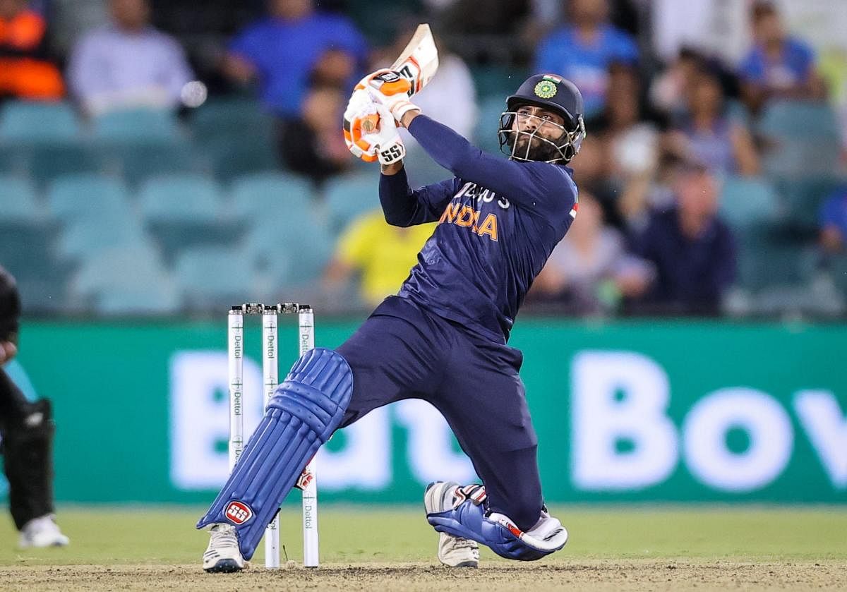 Ravindra Jadeja hits a boundary during the T20 cricket match between India and Australia at Manuka Oval in Canberra. Credit: AFP