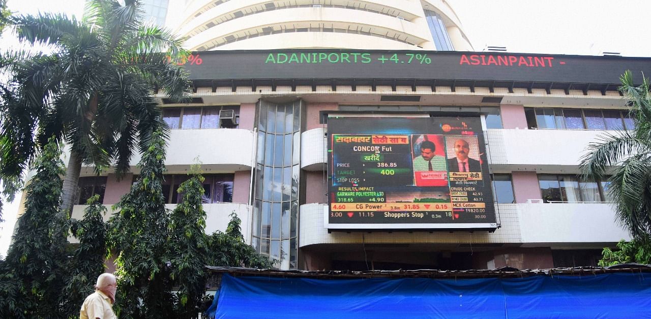 A digital screen on the facade of the Bombay Stock Exchange (BSE) building displays stock prices as Sensex soared, in Mumbai. Credit: PTI Photo