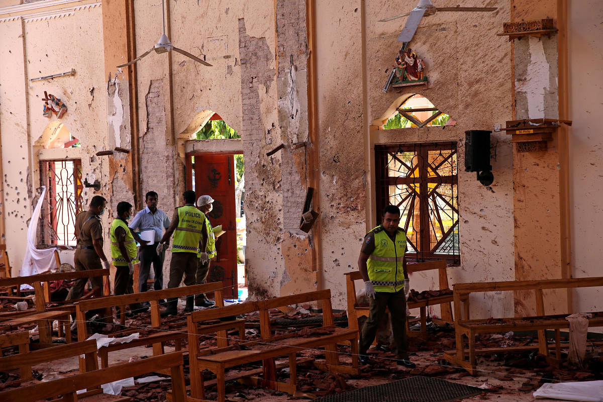 Police officers work at the scene at St. Sebastian Catholic Church, after bomb blasts ripped through churches and luxury hotels on Easter, in Negombo, Sri Lanka April 22, 2019. Credit: REUTERS File Photo
