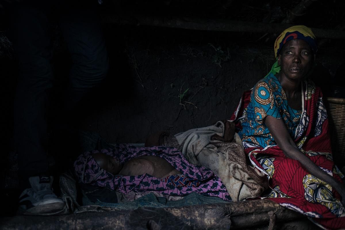 A woman from the Bafuliru community mourns the death of Regina, a 4-year-old displaced girl who died from lack of care, in the internally displaced persons (IDP) camp of Bijombo, South Kivu Province, eastern Democratic Republic of Congo. Credit: AFP