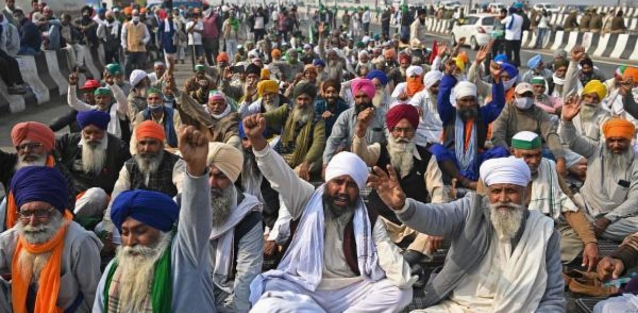 Farmers shout slogans during a protest against the central government’s recent agricultural reforms at the Delhi-Uttar Pradesh state border in Ghazipur. Credit: AFP Photo