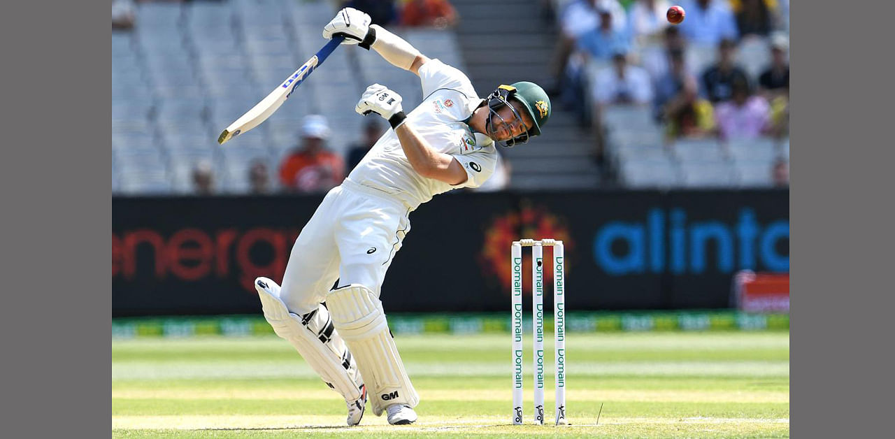 Australia's Travis Head ducks a bouncer from the New Zealand bowling in a Test match at the MCG in Melbourne in 2019. Credit: William West/AFP