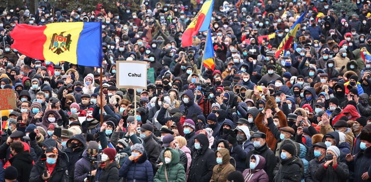 Supporters of Moldovan President-elect Maia Sandu attend a rally to demand the government to resign and to hold early parliamentary elections in Chisinau. Credit: Reuters photo.
