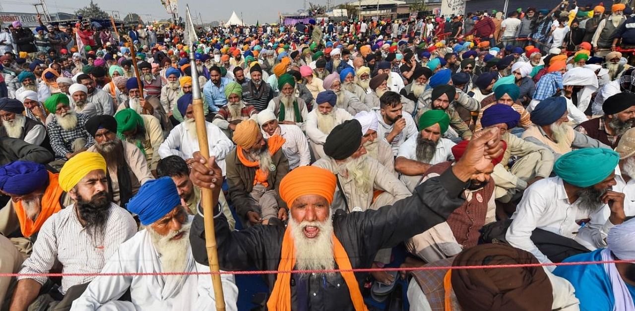 Farmers during their 'Delhi Chalo' protest march against the new farm laws, at Singhu border in New Delhi. Credit: PTI photo.