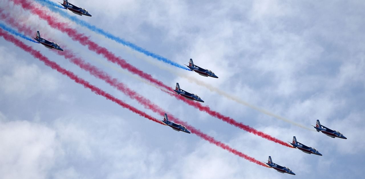 In this file photo taken on June 23, 2019 French elite acrobatic flying team "Patrouille de France" (PAF) performs a flying display on the last day of the International Paris Air Show at Le Bourget Airport, near Paris. Credit: AFP Photo