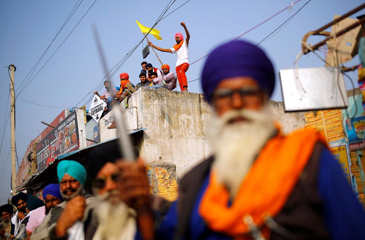Farmers attend a protest against the newly passed farm bills at Singhu border near New Delhi, India, December 7, 2020. Credit: REUTERS