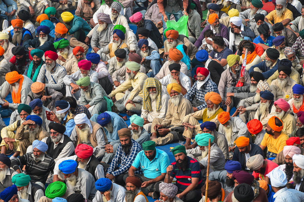 Farmers during their agitation against the Center's new farm laws, at Singhu border in New Delhi. Credit: PTI Photo. 