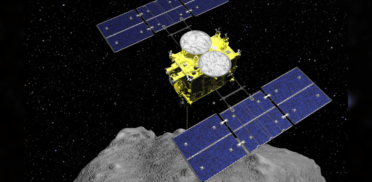 This computer graphics file image released by the Japan Aerospace Exploration Agency (JAXA) shows the Hayabusa2 spacecraft above the asteroid Ryugu. A small capsule from the Hayabusa2 successfully landed in a sparsely populated desert in the Australian Outback on Sunday, Dec. 6, 2020.  Credit: AP