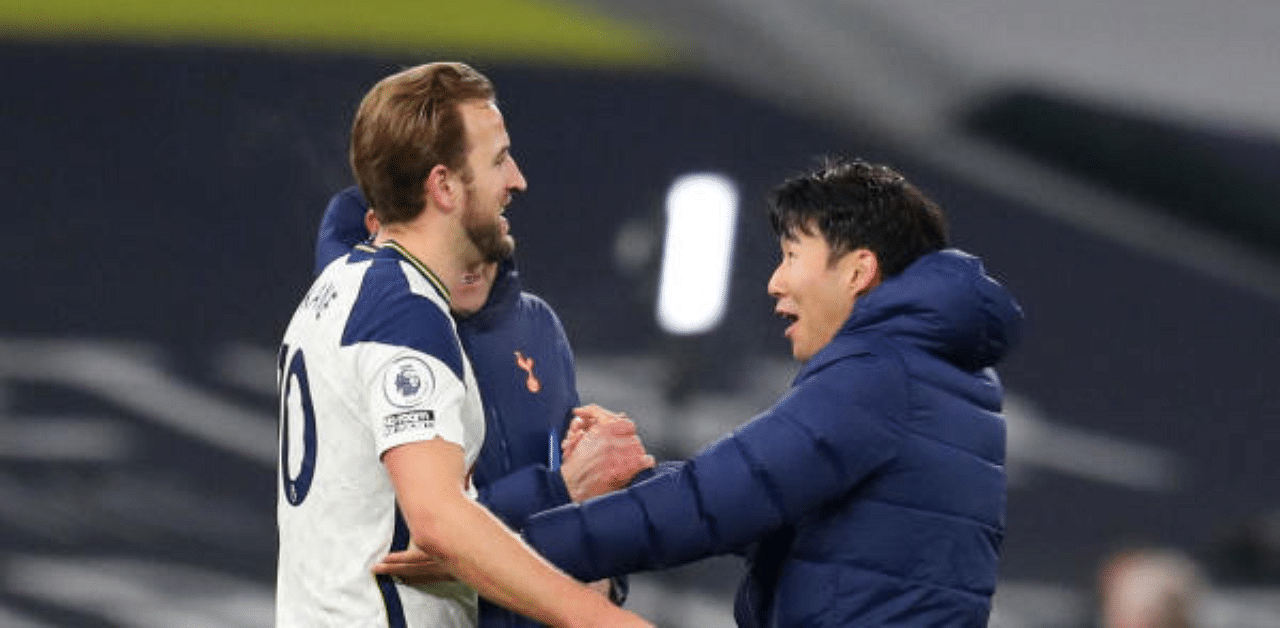 ottenham Hotspur's Harry Kane and Son Heung-min celebrate after securing a 2-0 win over Arsenal in the North London Derby. Credit: Reuters