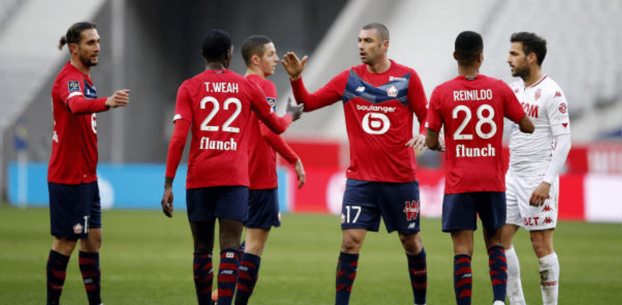 Lille's Burak Yilmaz and teammates celebrate after their 2-1 win over Monaco in the Ligue 1 on Sunday. Credit: Reuters