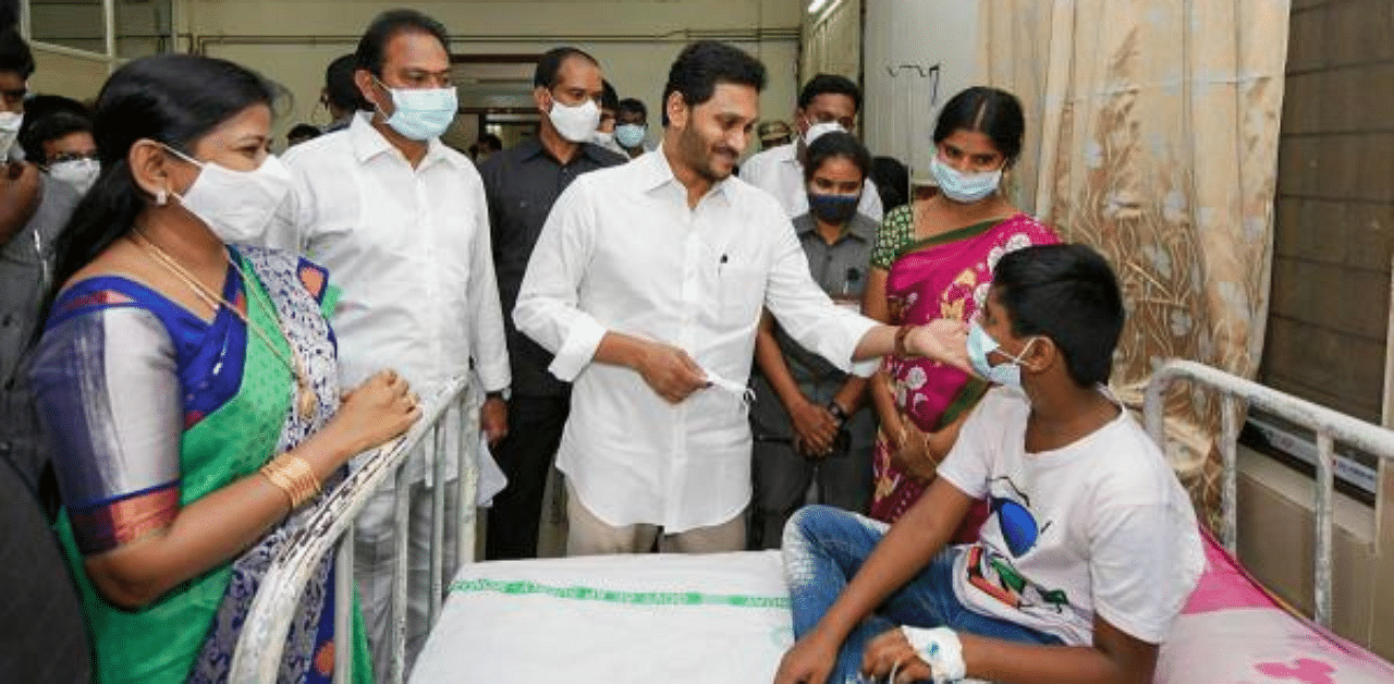 Andhra Pradesh CM Y S Jagan Mohan Reddy meets patients who mysteriously fell ill at a hospital in Eluru town, Godavari district. Credit: PTI